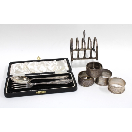 73 - Silver toast rack, Birmingham 1925 together with two silver and two silver plated napkin rings, and ... 