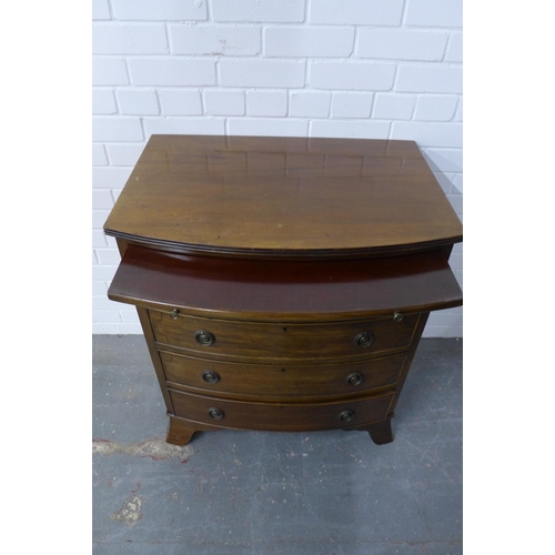 275 - Mahogany bow front chest of drawers with a pull out slide and four long drawers, on bracket feet, 85... 