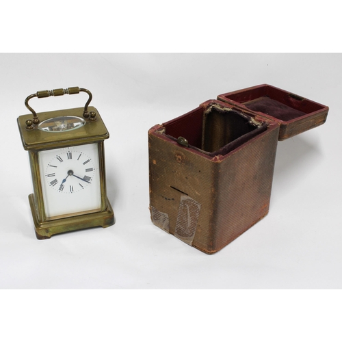 439 - Brass and glass panelled carriage clock with leather carry case