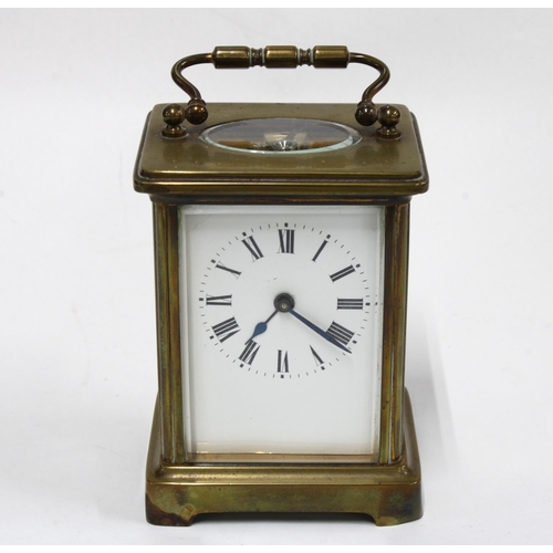 439 - Brass and glass panelled carriage clock with leather carry case