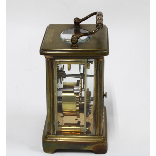 439 - Brass and glass panelled carriage clock with leather carry case