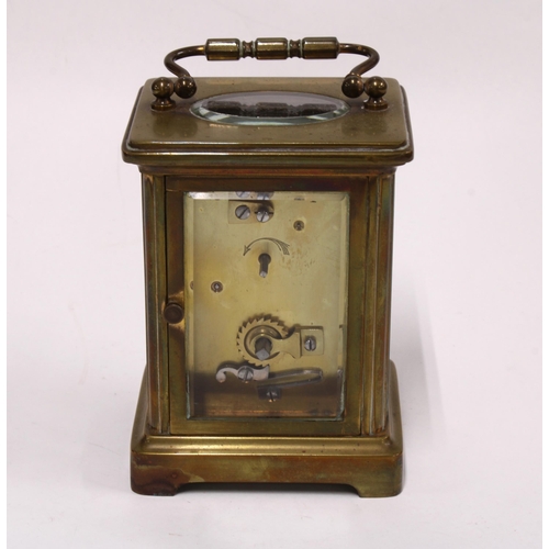 439 - Brass and glass panelled carriage clock with leather carry case