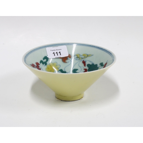 111 - Chinese yellow glazed bowl, the interior painted with flowers within a blue rim border, character ma... 