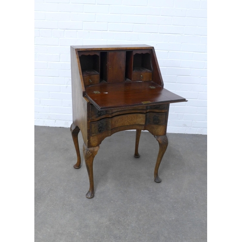 205 - Walnut bureau of small proportions, with a fall front and fitted interior over an inverted base with... 