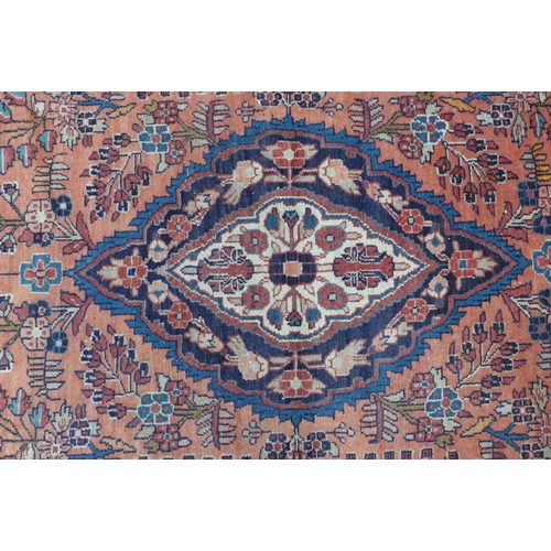 213 - Persian rug with central blue and ivory medallion and a red foliate field, 105 x 21ocm.