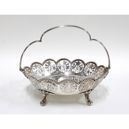 22 - Victorian swing handled silver basket, Henry Wilkinson & Co, London 1894, with pierced tree design a... 