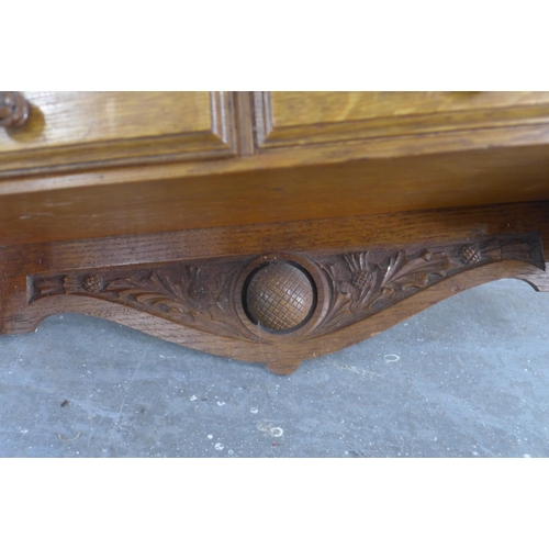 233 - Golf Interest: an oak 'Club Fixtures' wall shelf with four drawers, golf ball and thistle carving, 4... 