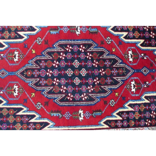 234 - Persian Mazlaghan rug,  central serrated lozenge and madder field,  195 x 132cm