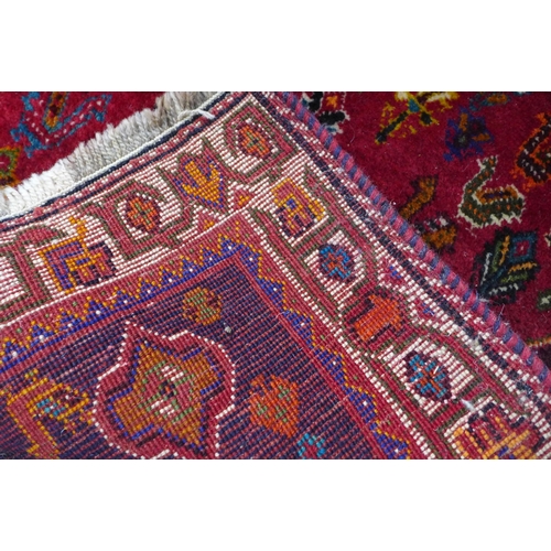 237 - Persian Qashqai rug, red foliate field with central blue medallion,  168 x 88cm