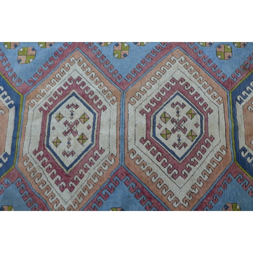 254 - A Turkish Kars style wool carpet, 343 x 220cm