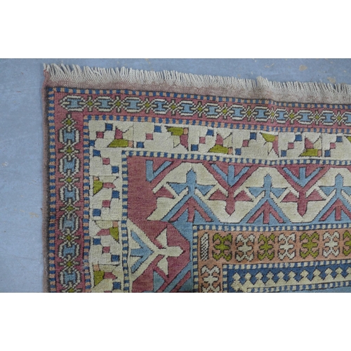 254 - A Turkish Kars style wool carpet, 343 x 220cm