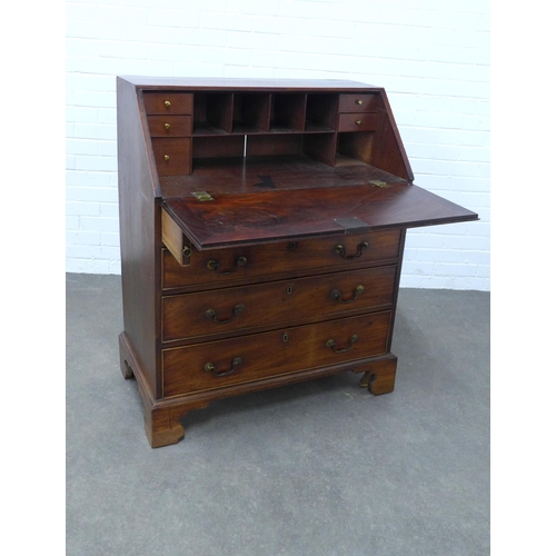 266 - Georgian mahogany bureau, with fall front and a  fitted interior, pull out slides, with four graduat... 