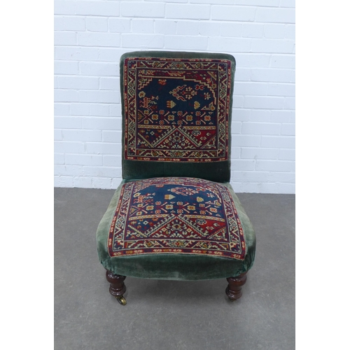 275 - Victorian carpet upholstered  low chair, mahogany legs and brass castors, 58 x 85 x 60cm.