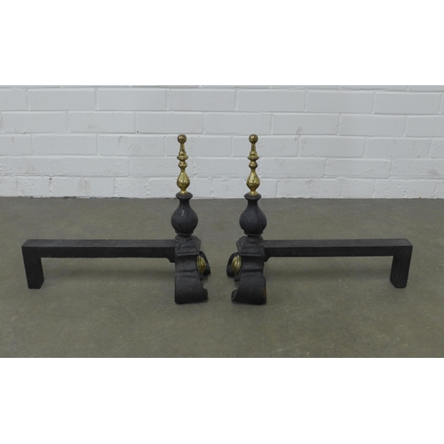 276 - Pair of brass and cast iron fire dogs, 45 x 40 x 19cm. (2)