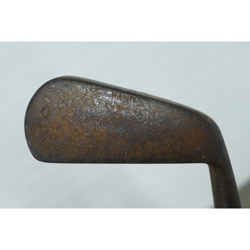 281 - Early 20th century brass stick stand an a child's golf club. (2)