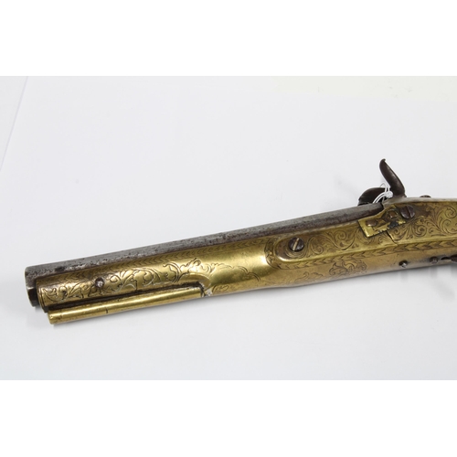 310 - A 19th century brass mounted percussion pistol, possibly Scottish, with foliate decoration, with oct... 