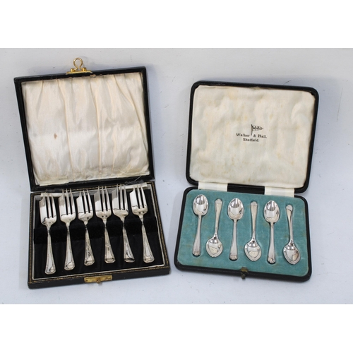 322 - Box containing a quantity of silver plate, including a pair of candlesticks, trays, coffee set, cutl... 