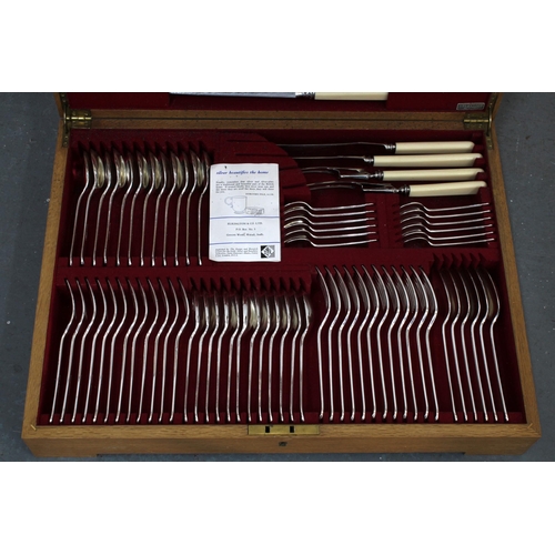 323 - Elkington & Co silver plate cutlery canteen, 12 place setting, the knives with composite handles  57... 