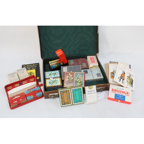 325 - A vintage brown leather case containing a collection of playing cards and card related ephemera, 40 ... 