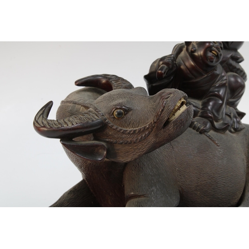 328 - Pair of Chinese carved wooden water buffalo and rider table lamp bases, on stands, with screw fittin... 