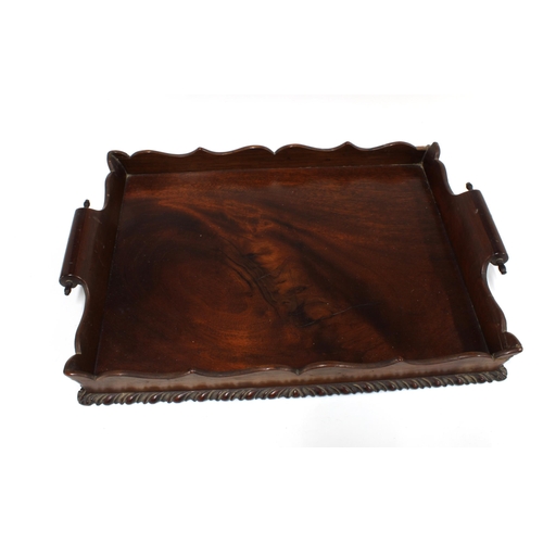 336 - William IV mahogany tray with serpentine gallery with scrolling twin handles and a gadrooned edge,  ... 