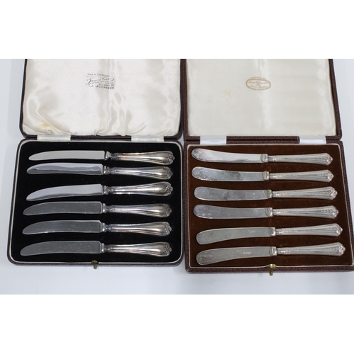 48 - Cased set of six Victorian silver handled butter knives together with another set with Sheffield sil... 