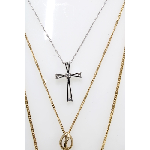 61 - Two 9ct gold pendant necklaces and a 9ct white gold diamond set crucifix (3)