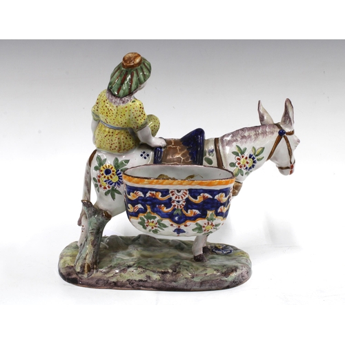 93 - Faience polychrome figure of a woman and mule / donkey with tw baske, 23 x 21cm