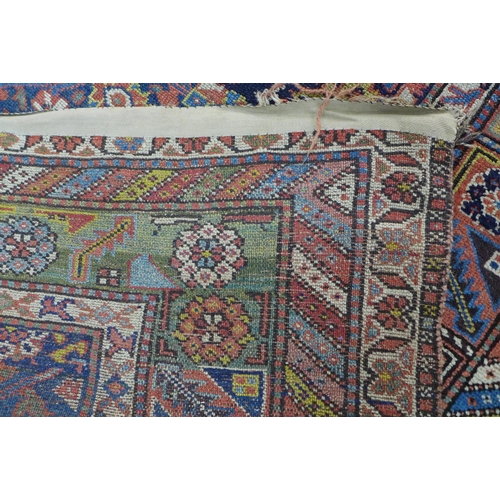 220 - Persian rug, blue foliate field,  300 x 141cm