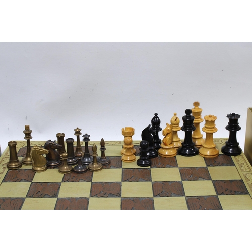 364 - Composite chessboard, 38cm, together with a set of wooden chess pieces, tallest piece 7cm, and a set... 