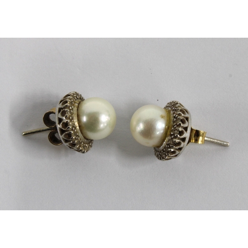 20 - A pair of vintage cultured pearl stud earrings, yellow metal posts (2)