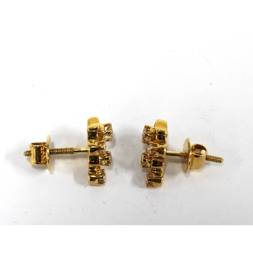 23 - A pair of 18ct gold diamond set earrings (2)