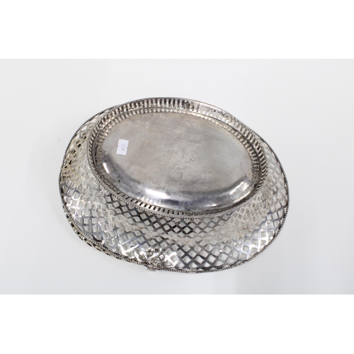 31 - A white metal swing handled basket, 32cm long