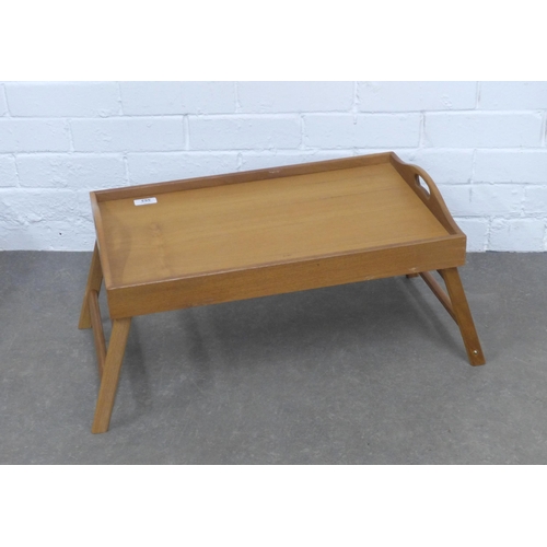 353 - Dolphin teak bed tray with fold out legs, 56 x 35cm, together with a black metal table lamp 56cm (2)