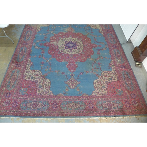 360 - Late 19th / early 20th century Country House  Persian carpet, with worn blue field and central folia... 