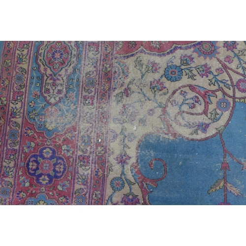 360 - Late 19th / early 20th century Country House  Persian carpet, with worn blue field and central folia... 