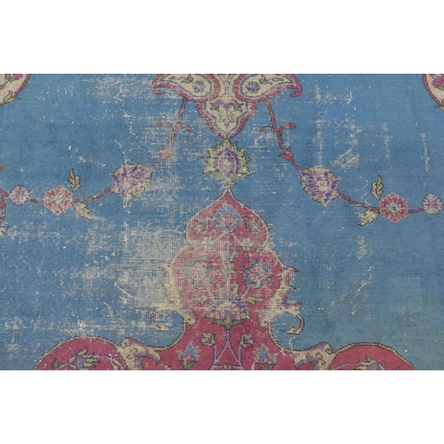 360 - Late 19th / early 20th century Country House  Persian carpet, with worn blue field and central folia... 