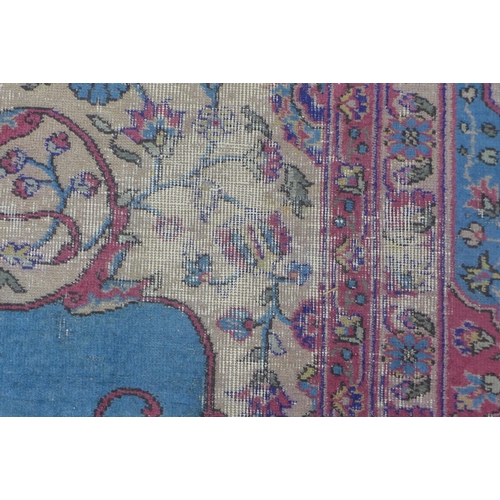 360 - Late 19th / early 20th century Country House  Persian carpet, with worn blue field and central folia... 