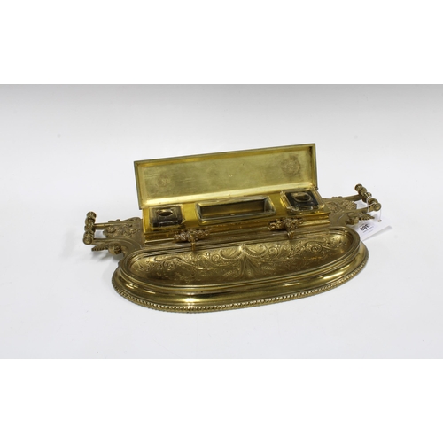 380 - A Victorian lacquered brass desk inkstand, with pierced brass gallery and a rectangular hinged cover... 