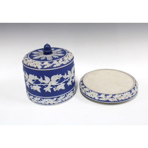 384 - Wedgwood style blue and white Jasper cheese dome and stand, with leaf and berry sprigged pattern, 28... 