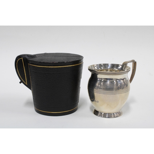 26 - George V silver christening mug, London 1911, 9cm high, with original leather case