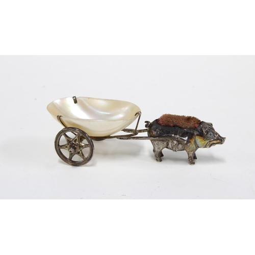 34 - An Edwardian novelty silver pig pin cushion, with a mother of pearl thimble holder cart, London 1905... 