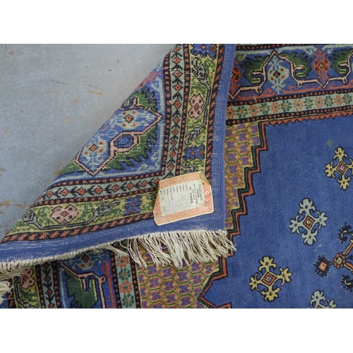 Tunisie rug with blue field, 170 x 123cm.