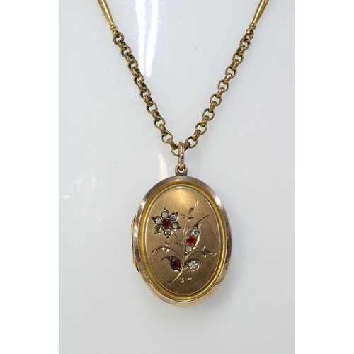 29 - 9ct gold gemset tennis bracelet and a gold plated locket on yellow metal chain necklace