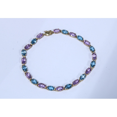 29 - 9ct gold gemset tennis bracelet and a gold plated locket on yellow metal chain necklace