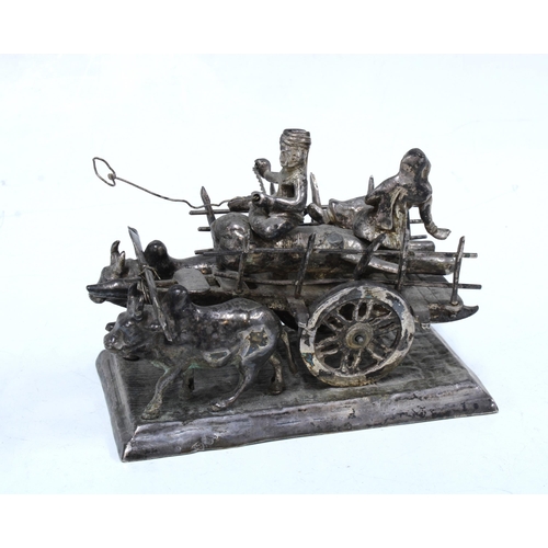 60 - Eastern white metal Ox and cart with figures, 22cm long and three Chinese white metal plaques (4)