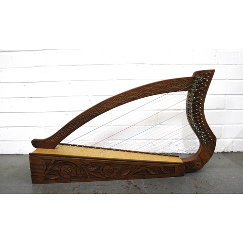 Table harp with celtic knot inlay and foliate carved base, 74 x 40cm