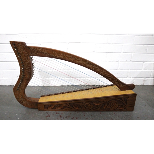Table harp with celtic knot inlay and foliate carved base, 74 x 40cm