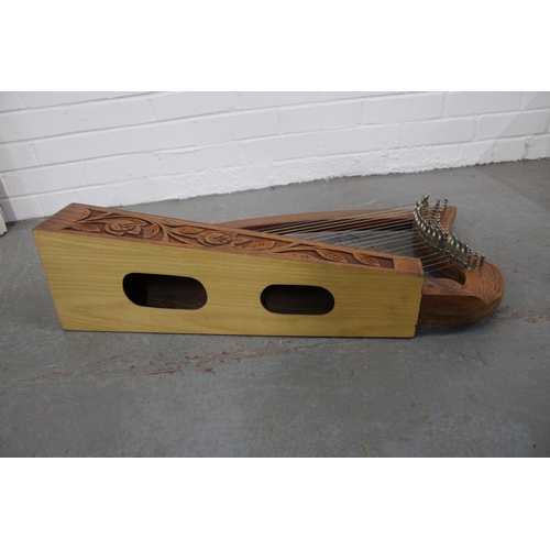 Table harp with celtic knot inlay and foliate carved base, 74 x 40cm