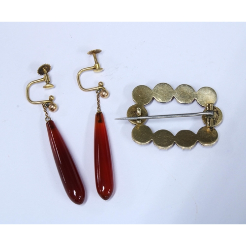 32 - A pair of cornellian drop earrings set in yellow metal with indistinct marks and a cornellian brooch... 